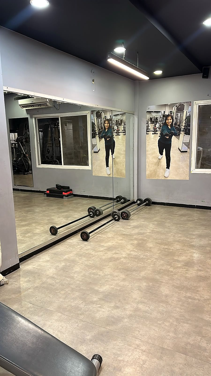Strength area with barbells and mirrors