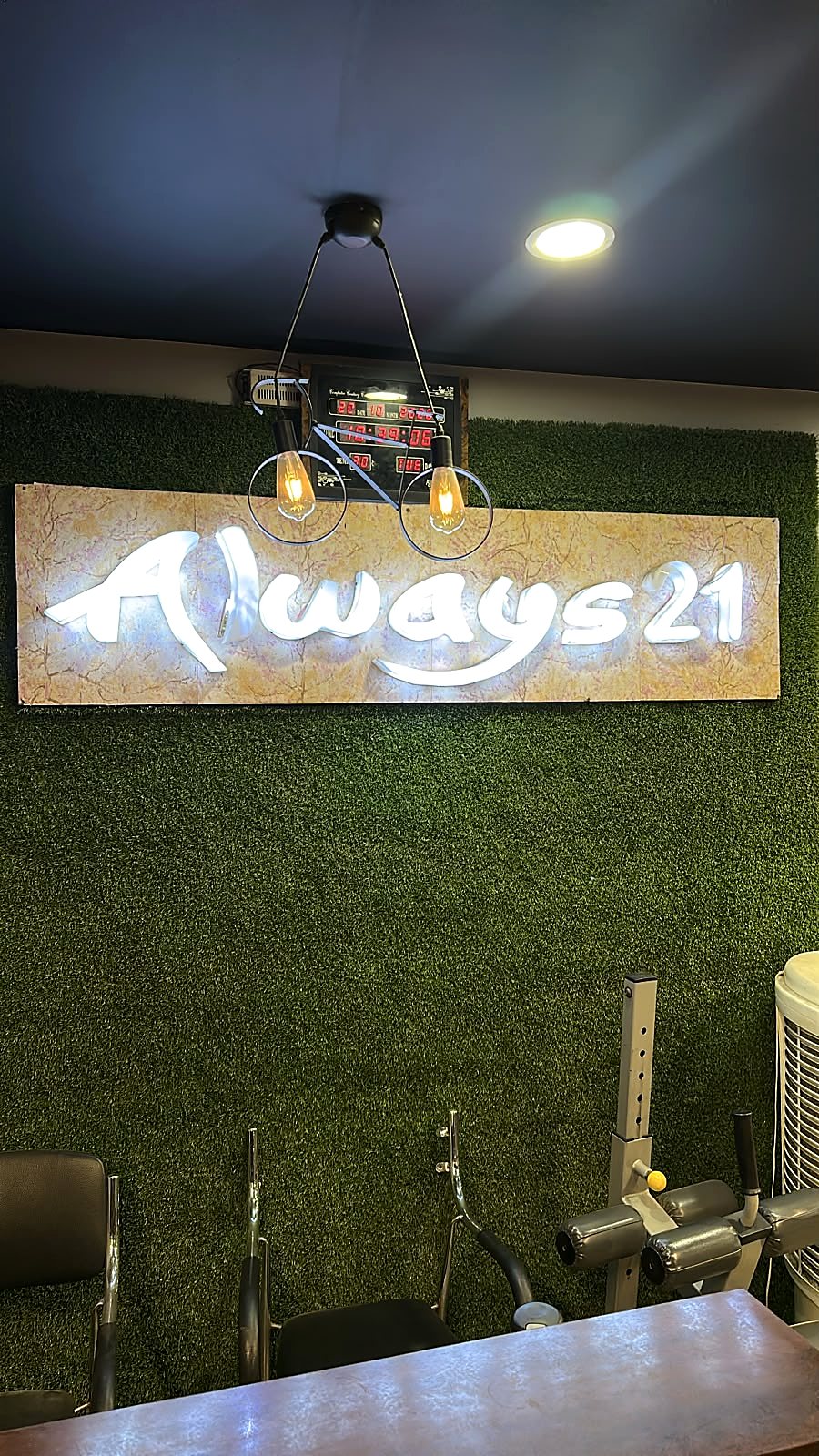 Always21 lit sign on the reception wall